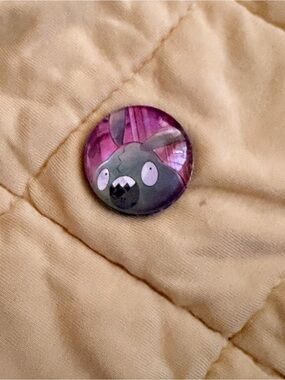Pokemon Tan Quilted Puffer Jacket with Purple Character Button